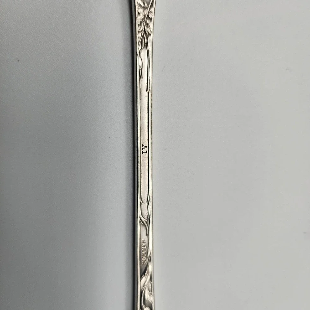 Silver serving fork by R. Wallace 1835 A1 Blossom pattern 8.75